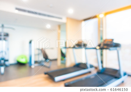 Abstract blur gym room interior with fitness equipment 61646150