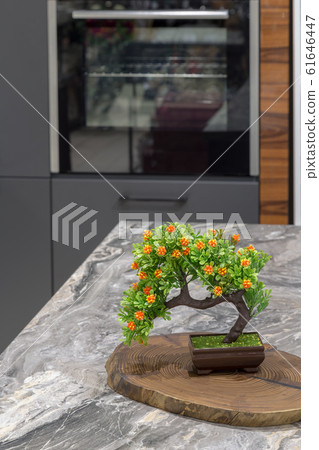 Artificial flowers in the form of a tree on a Artificial flowers in the form of a tree on a 61646447