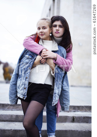 young happy students teenagers at university building on stairs, lifestyle people concept brunette and blond girl young happy students teenagers at university building on stairs, lifestyle people concept brunette and blond girl 61647269