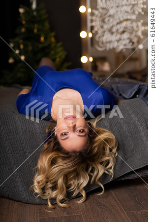 Beautiful woman with in a New Year s interior Beautiful woman with in a New Year s interior 61649443