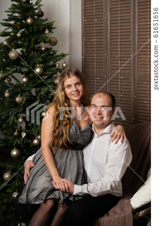 Beautiful and happy man and woman at the New Year 61651656