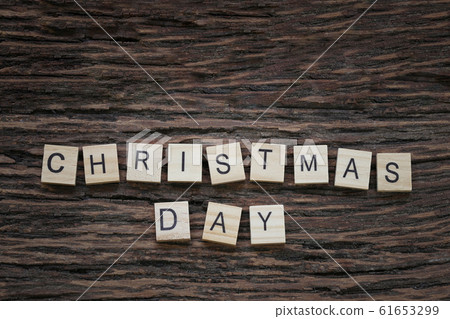 Christmas letters on a wooden floor and a copy space. 61653299