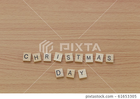 Christmas letters on a wooden floor and a copy space. 61653305