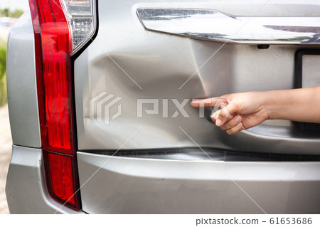 Sufferer hand point of vehicle car bumper dented broken from collision crash damage accident on road,traffic accident and insurance concept 61653686