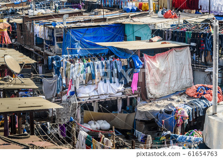 View of Dhobi Ghat is outdoor laundry in Mumbai. View of Dhobi Ghat is outdoor laundry in Mumbai. 61654763