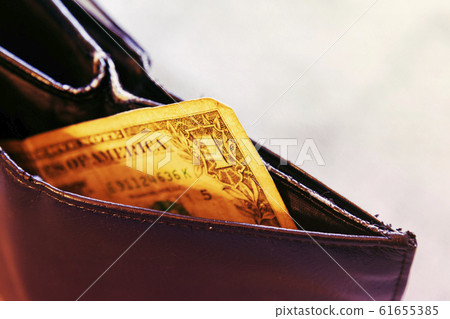 Empty male wallet with one dollar bill. financial 61655385