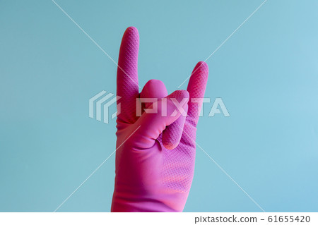 Hand with cleaning glove making fist Hand with cleaning glove making fist 61655420