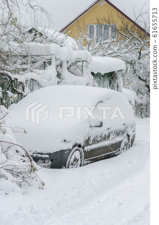 Snow-covered machine. Car under the snow. Lots of Snow-covered machine. Car under the snow. Lots of 61655713