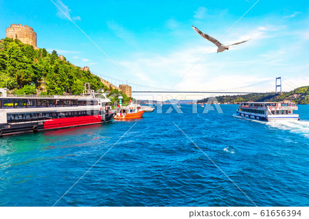 Ships in the Bosporus near the Sultan Fatih Mehmet Bridge and the Rumeli Hisar , Istanbul, Turkey Ships in the Bosporus near the Sultan Fatih Mehmet Bridge and the Rumeli Hisar , Istanbul, Turkey 61656394