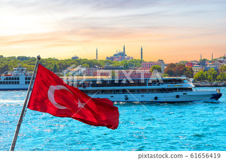 Turkish flag, the ship in the Bosporus and Hagia Sophia in the background, Istanbul, Turkey 61656419