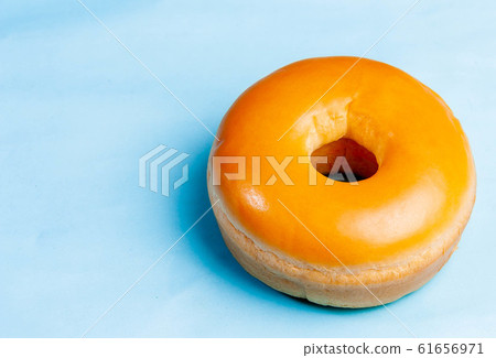 Donut bread on a blue background Donut bread on a blue background 61656971