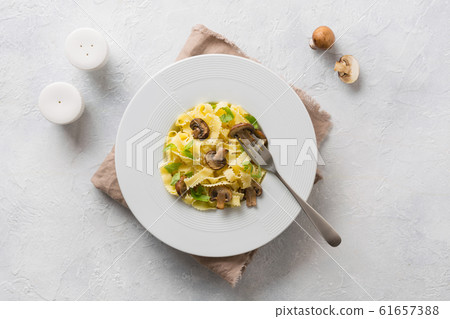 Spaghetti reginelle pasta with mushrooms. Spaghetti reginelle pasta with mushrooms. 61657388