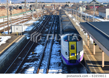 Photographing the scenery of the super express Hokuto, an express train that arrives and departs from Omanabane Station in Omanbe-cho, Hokkaido in winter Photographing the scenery of the super express Hokuto, an express train that arrives and departs from Omanabane Station in Omanbe-cho, Hokkaido in winter 61659811