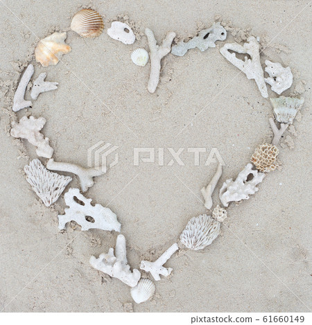 Seashells and corals heart frame on sand background. Seashells and corals heart frame on sand background. 61660149