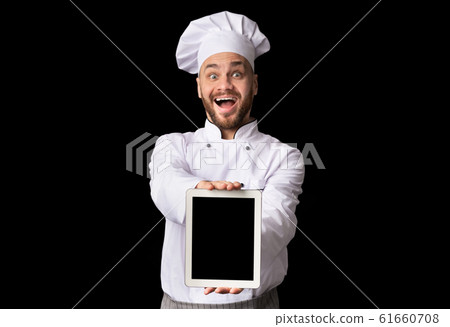 Chef Showing Tablet With Empty Screen Posing On Black Background Chef Showing Tablet With Empty Screen Posing On Black Background 61660708