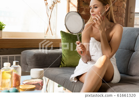 Beauty Day. Woman doing her daily skincare routine at home 61661320