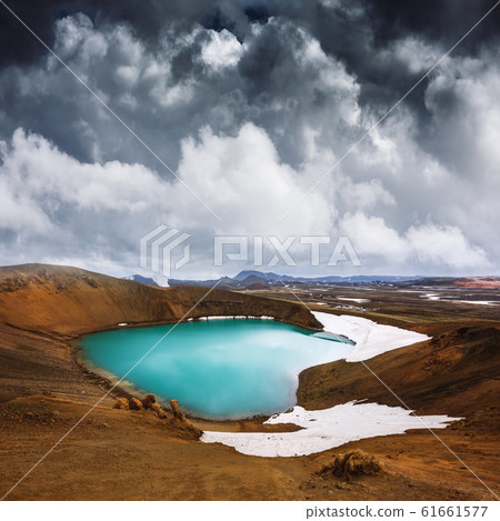 Acid hot lake in the geothermal valley Leirhnjukur 61661577