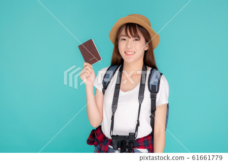 Beautiful portrait young asian woman wear hat smile confident holding passport and camera 61661779