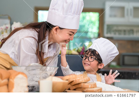 Cute little Asian boy painting beautiful woman 61661797