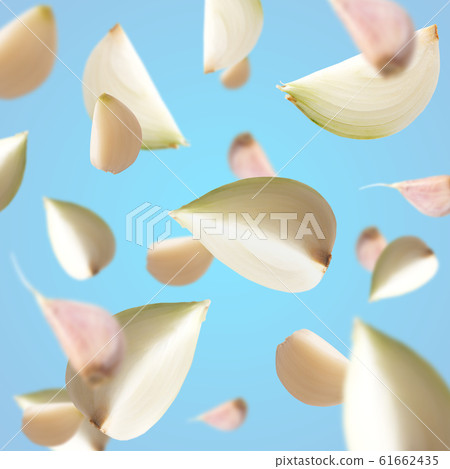 Fresh flying onion over white background, isolated 61662435
