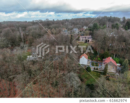 Aerial view of big villas with garden surrounded by forest during winte season Aerial view of big villas with garden surrounded by forest during winte season 61662974