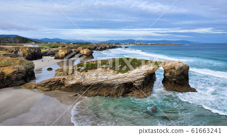 Natural stone arch on Playa de Las Catedrales, Spain 61663241
