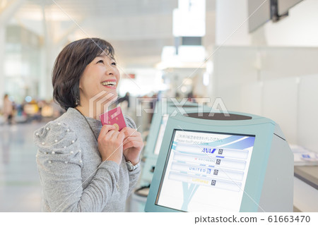 First boarding procedure Emotional and emotional scene of a middle woman who is going to issue a ticket 61663470