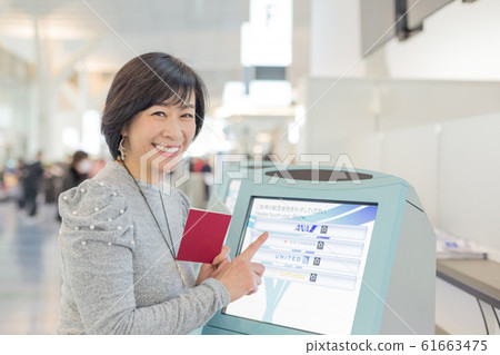 First boarding procedure Emotional and emotional scene of a middle woman who is going to issue a ticket 61663475