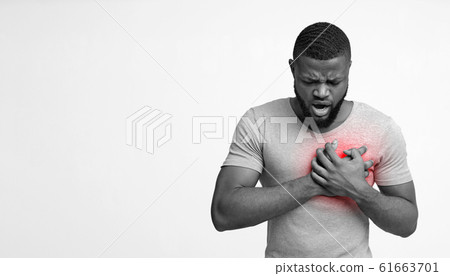 Black guy having acute pain in chest 61663701