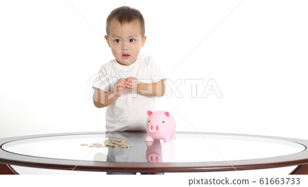 Boy saving money Boy saving money 61663733