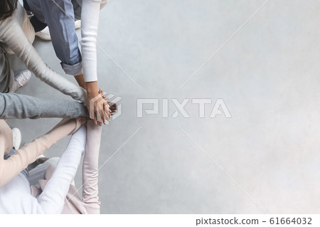 International group of partners putting hand together International group of partners putting hand together 61664032