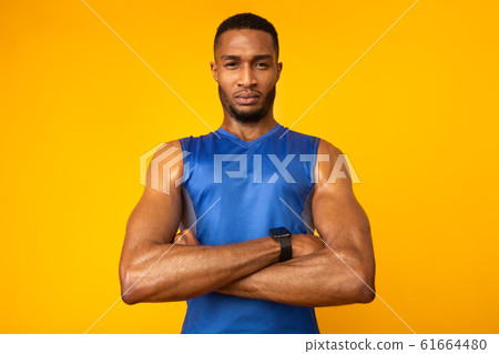 Afro sportsman with crossed arms looking at camera 61664480