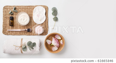 Spa composition of natural materials and rose petals on white 61665846