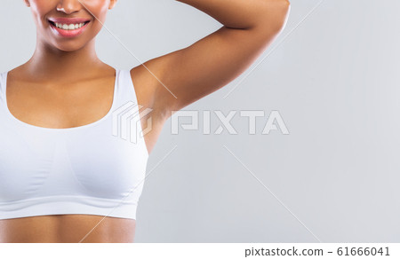 Cropped of african lady showing her clean armpit Cropped of african lady showing her clean armpit 61666041