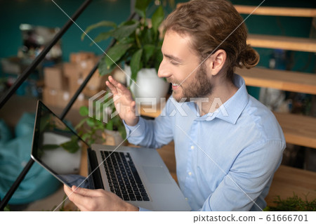 Man using his laptop while having a video call 61666701