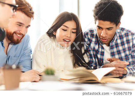 Knowledge and education concept. Happy students in library 61667079