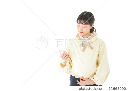 Young pregnant woman taking a temperature measurement Young pregnant woman taking a temperature measurement 61668900