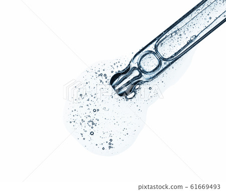 Clear serum in pipette isolated on white background. Cosmetic liquid dropper with bubbles top view. 61669493