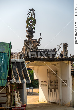 Ancient gate of Wat Pong Yang Kok in Hang Chat District Ancient gate of Wat Pong Yang Kok in Hang Chat District 61669802