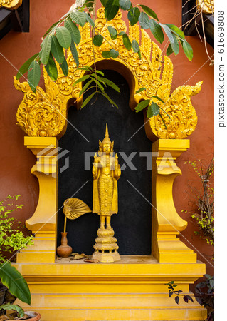 Standing Buddha Statue at Wat Phra That Doi Phra Chan in Mae Tha District 61669808