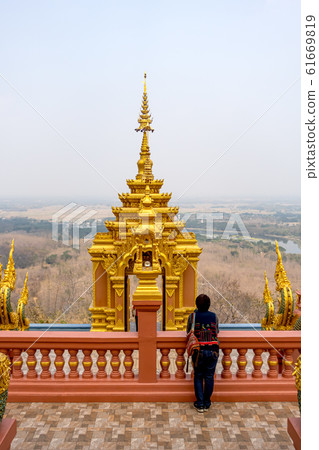 Female tourist at Wat Phra That Doi Phra Chan on the top of mountain in Mae Tha District 61669819