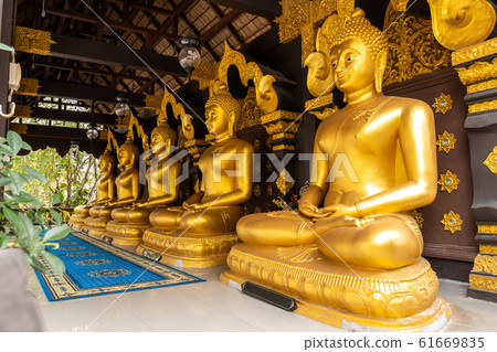 Row of Buddha Statues in Wat Phra That Doi Phra Chan in Mae Tha District Row of Buddha Statues in Wat Phra That Doi Phra Chan in Mae Tha District 61669835