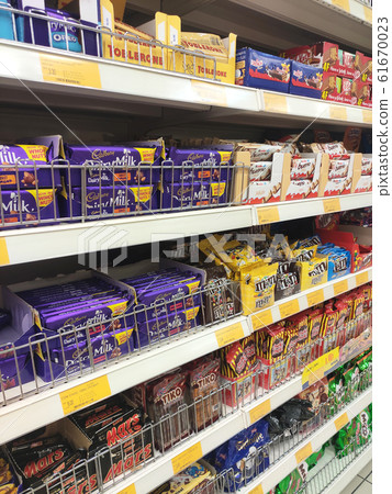 Various type and brand of chocolate product packed in the nice packaging displayed in the supermarket rack for sale.  61670023