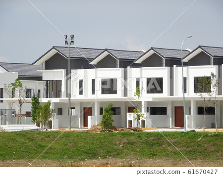 New double story luxury terrace house under construction in Malaysia.  Designed by an architect with a modern and contemporary style.  61670427