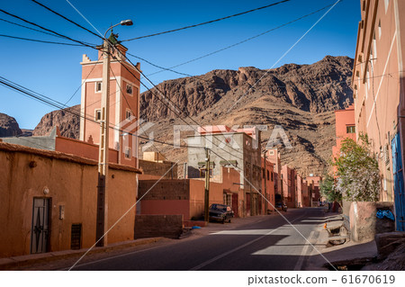 Orange houses with canyons in the background, Tinghir, Morocco 61670619
