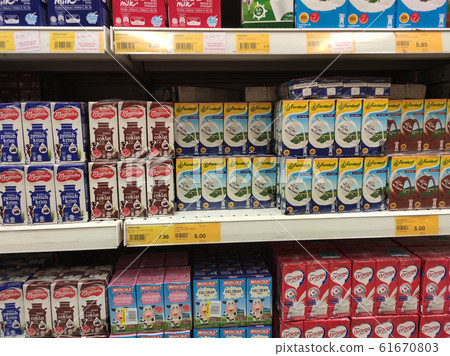 Processed and fresh milk packed in the paper box and displayed on the rack inside the supermarkets. Sorted by brand and type for easy for the customer to choose. Processed and fresh milk packed in the paper box and displayed on the rack inside the supermarkets. Sorted by brand and type for easy for the customer to choose. 61670803