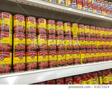 Sardine fish in a can. The food has been processed and stored in the can to extend its life. Displayed on the rack for sale. Sardine fish in a can. The food has been processed and stored in the can to extend its life. Displayed on the rack for sale. 61671024