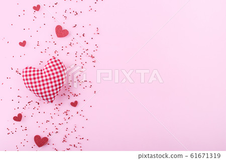 Red hearts on pink background 61671319