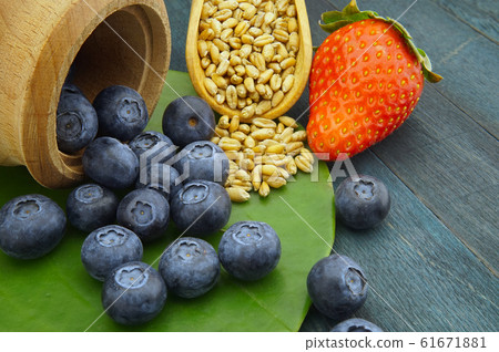 Food still life with blueberries and strawberries 61671881
