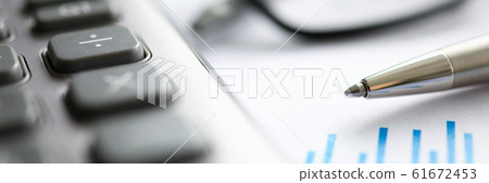 Silver pen with paper chart and glasses lie in office table Silver pen with paper chart and glasses lie in office table 61672453